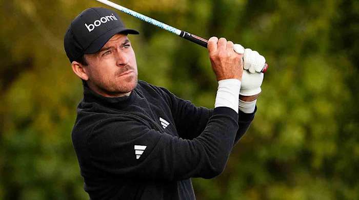 Nick Taylor watches a shot at the 2024 WM Phoenix Open.